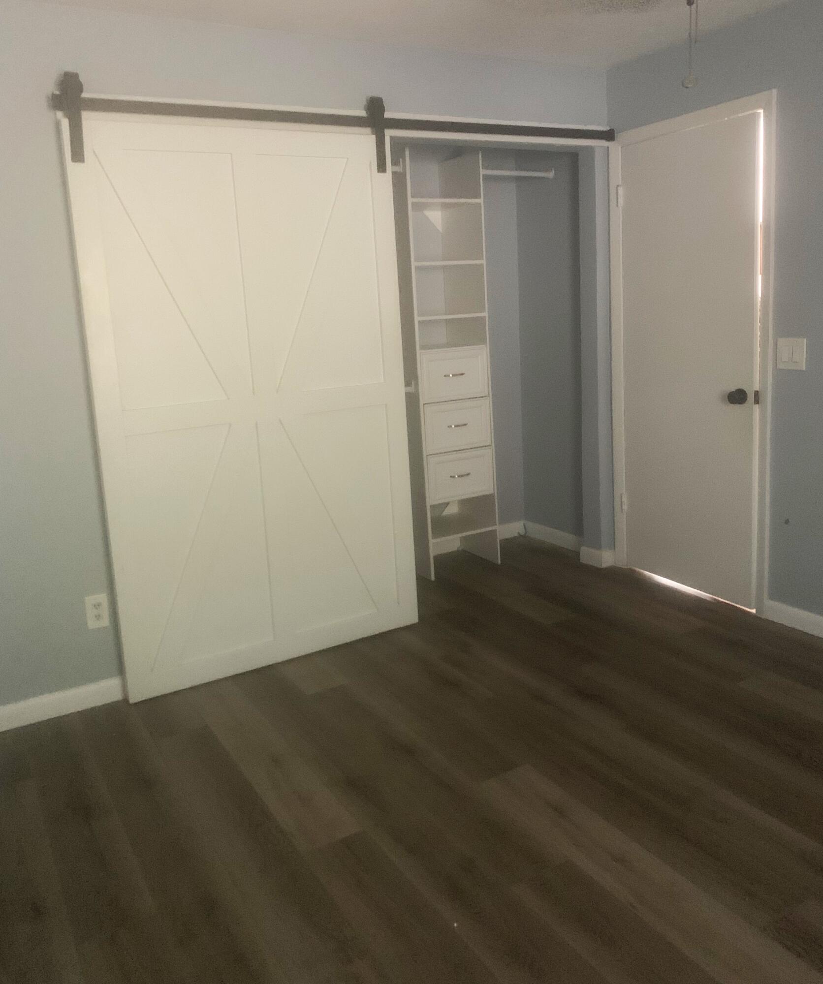 6030 Wolfe Street Jupiter, FL 33458 - Photo 6 of 14 a view of an empty room