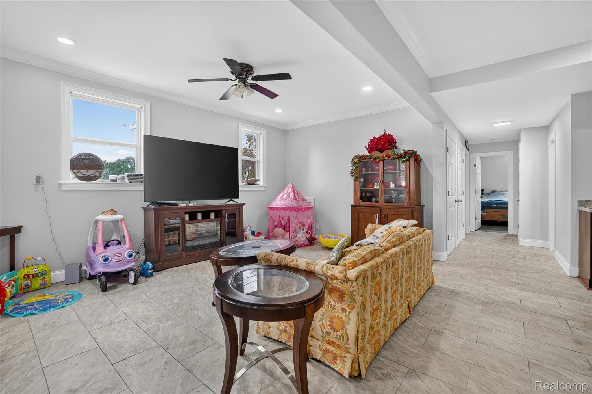 6524 Kelly Road Flushing, MI 48433 - Photo 19 of 47 Spacious open-concept room featuring light gray walls, recessed lighting, and a ceiling fan