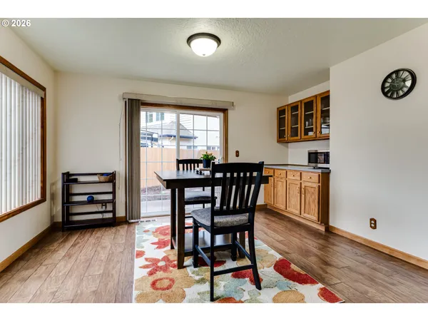 a view of a dining room with furniture and wooden floor