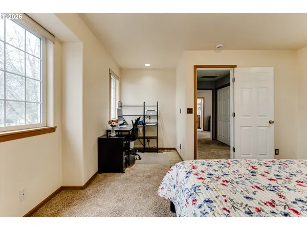 a bedroom with a bed and a dresser