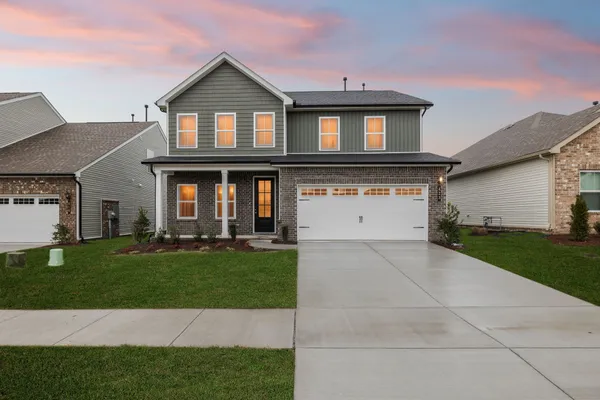 front view of a house with a yard