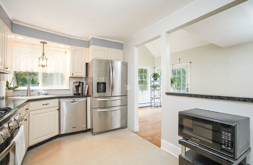 15 Holyoke Road Westfield, MA 01085 - Photo 13 of 41 a kitchen with stainless steel appliances a refrigerator sink and microwave