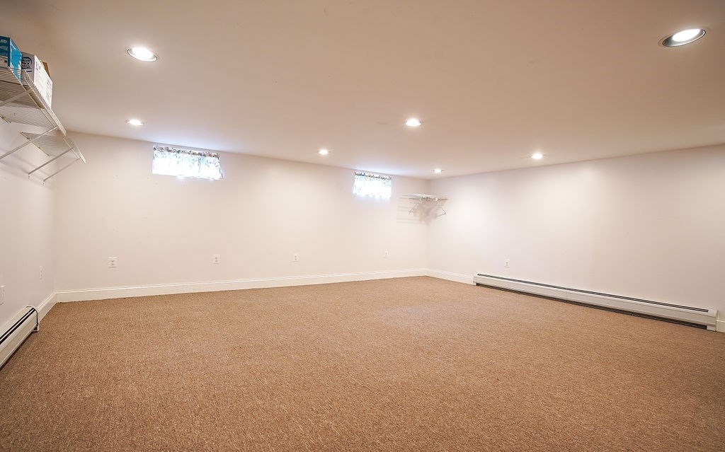 15 Holyoke Road Westfield, MA 01085 - Photo 33 of 41 an empty room with a projector and a fan