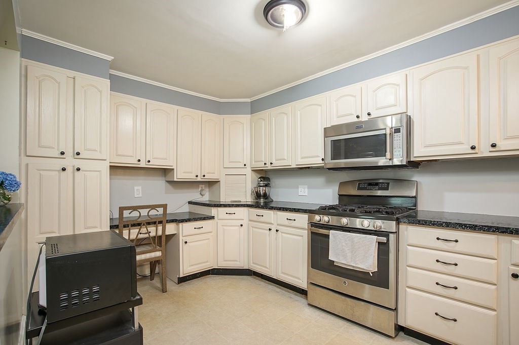 15 Holyoke Road Westfield, MA 01085 - Photo 10 of 41 a kitchen with granite countertop white cabinets and stainless steel appliances