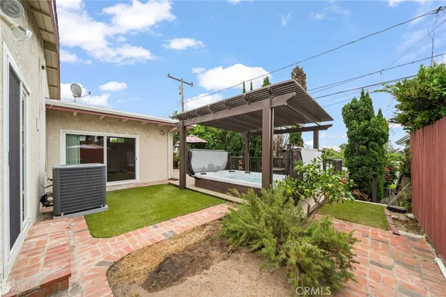 a view of a house with backyard and porch