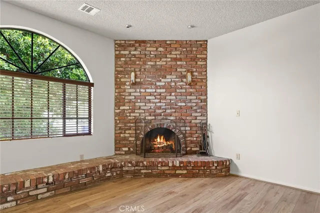 a living room with a fireplace and a floor