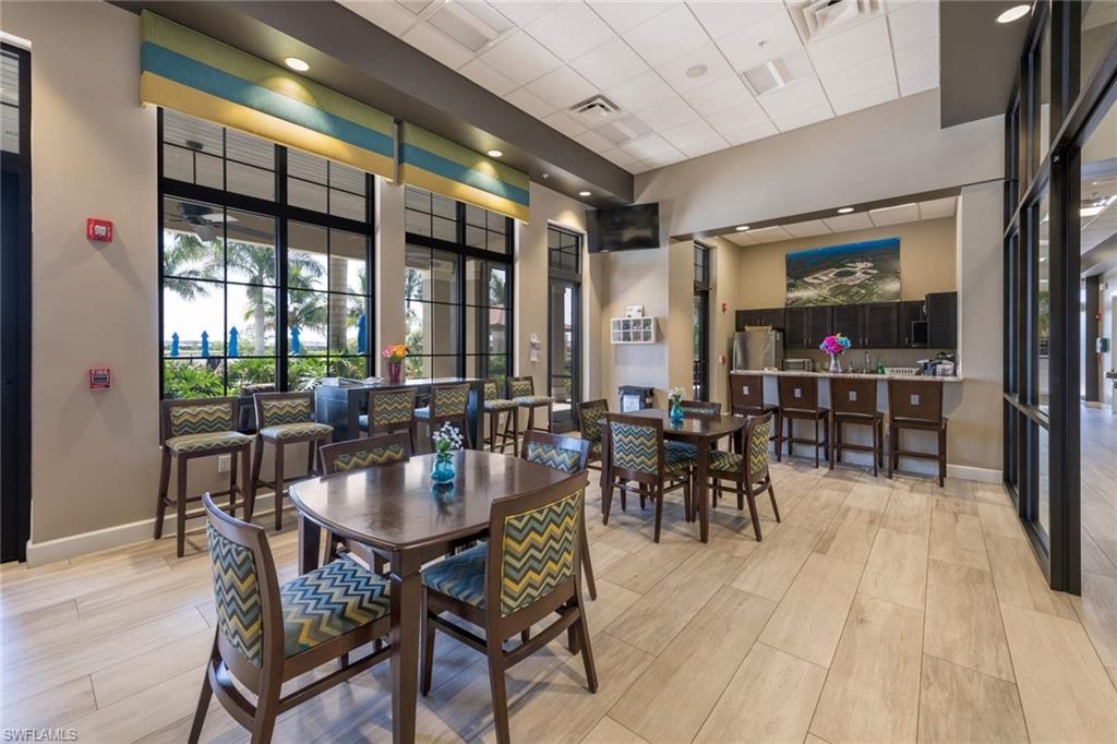 1229 Manado Drive Naples, FL 34113 - Photo 32 of 35 a view of a dining room with furniture window and outside view