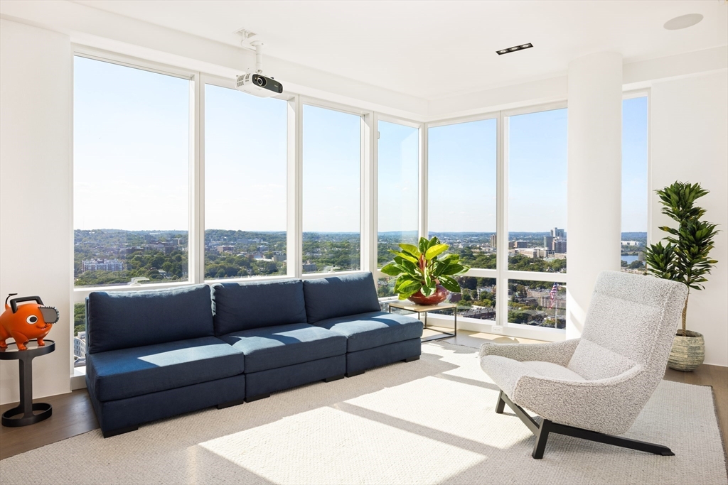 188 Brookline Avenue, Unit 27A/C Boston, MA 02215 - Photo 11 of 17 a living room with furniture and a large window