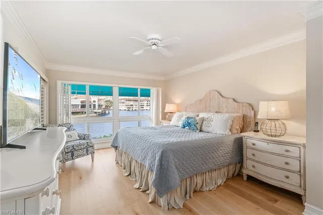 a bedroom with a bed a table and chair