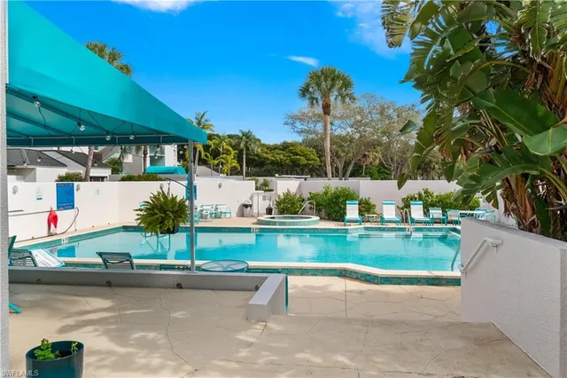 a view of swimming pool and outdoor seating