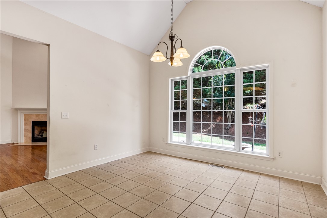 135 Sunset Bay Boulevard Seneca, SC 29672 - Photo 13 of 50 A graceful arched window illuminates this dining area with abundant natural light.
