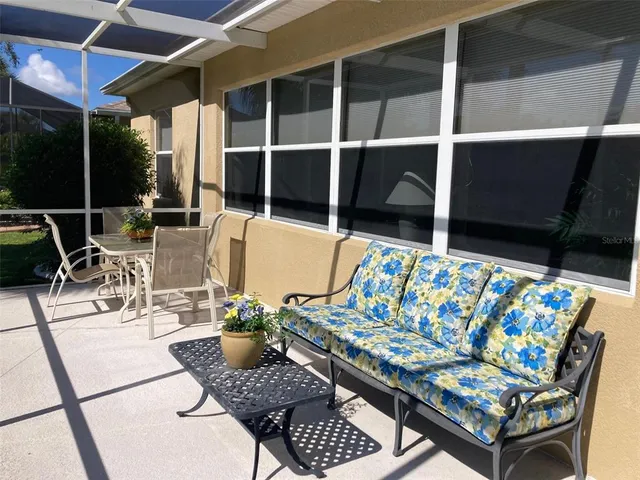 a outdoor living space with furniture and a potted plant