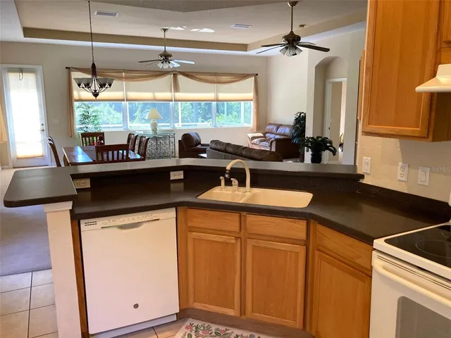 a kitchen with a sink cabinets and window