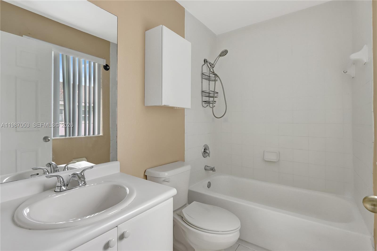 2874 Southeast 15th Road, Unit 52 Homestead, FL 33035 - Photo 15 of 16 a bathroom with a sink toilet and bathtub