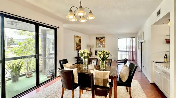 a view of a dining room with furniture window and outside view