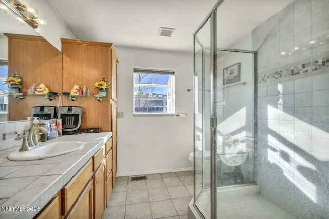 a bathroom with a sink double vanity and a mirror