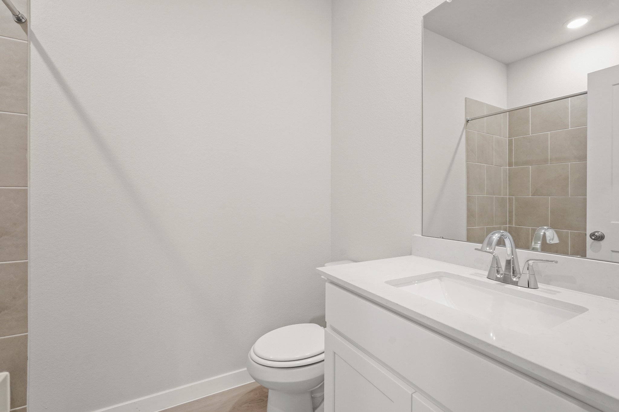 113 Rising Cedar Lane Hockley, TX 77447 - Photo 12 of 27 a bathroom with a sink toilet and a mirror