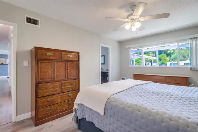 a bedroom with a bed and a dresser