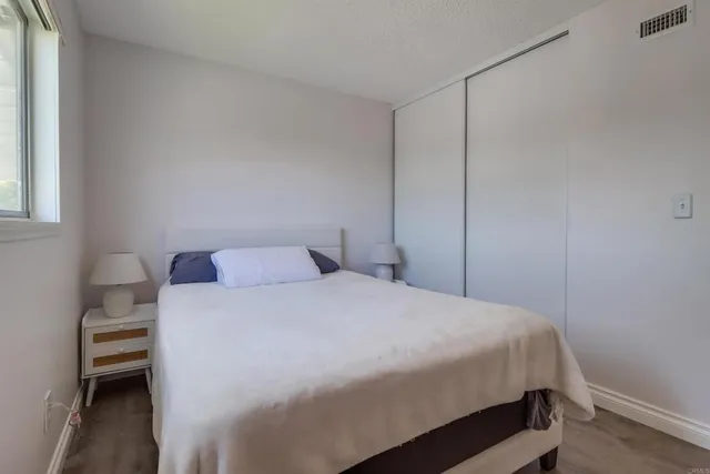 a bedroom with a bed and a cabinets