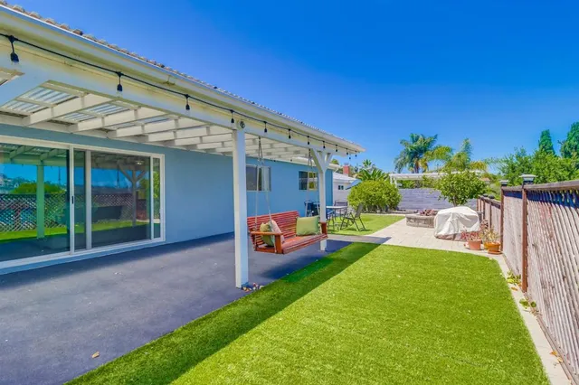 a front view of a house with a yard and porch
