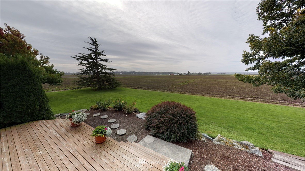 16936 Bradshaw Road Mount Vernon, WA 98273 - Photo 3 of 25 a view of a lake with a yard
