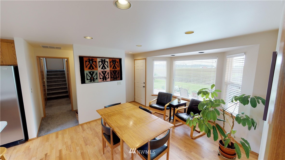 16936 Bradshaw Road Mount Vernon, WA 98273 - Photo 6 of 25 a living room with furniture and a potted plant