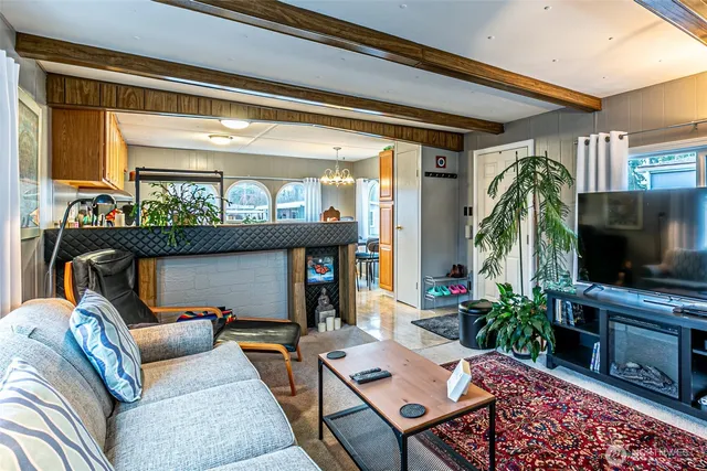 a living room with furniture and a rug