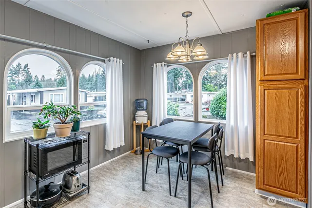a view of a dining room with furniture window and outside view