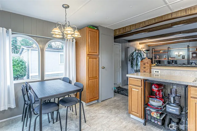 a kitchen with a sink and a refrigerator