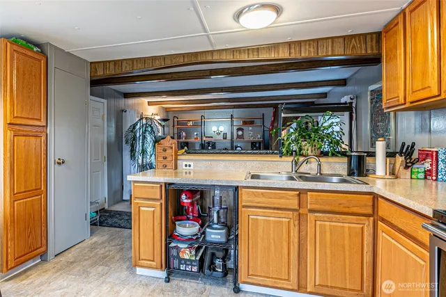 a dining room with furniture a chandelier and a rug