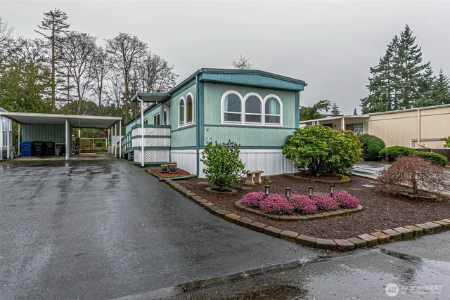 a front view of a house with yard