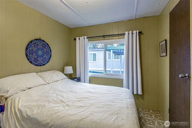 a bathroom with a sink vanity and mirror