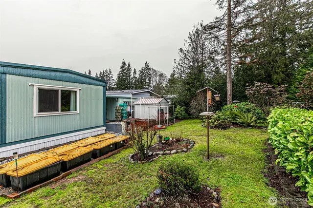 a house view with a sitting space and garden space