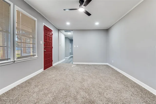 a view of an empty room with a window