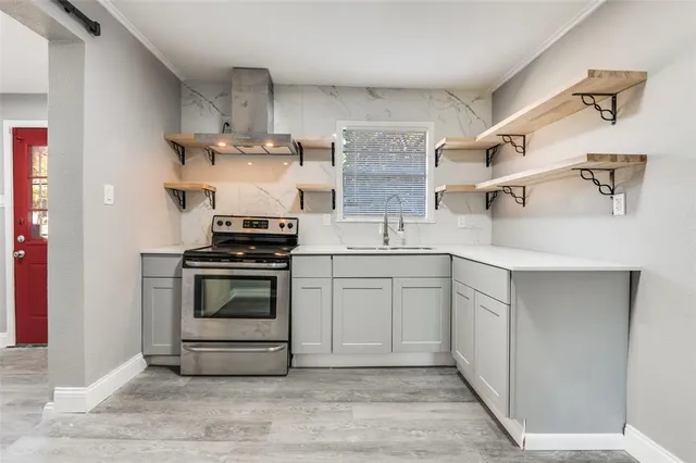 a kitchen with cabinets and appliances