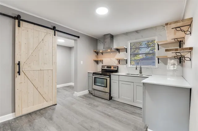 a kitchen with cabinets and appliances