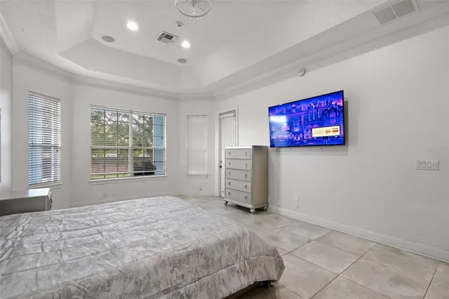 a view of a hallway with paintings on the wall