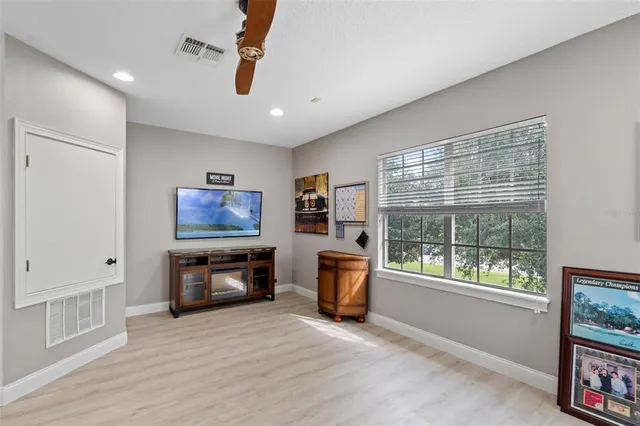 a view of backyard with seating area and green space