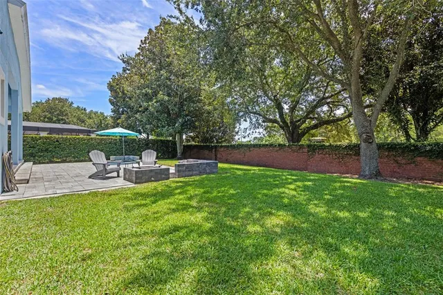 an aerial view of residential houses with outdoor space and swimming pool