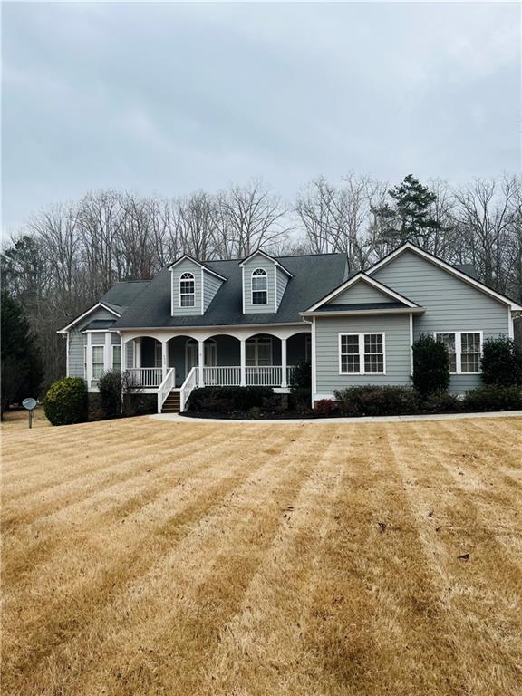 4370 Hopewell Road Cumming, GA 30028 - Photo 1 of 1 a front view of a house with a yard