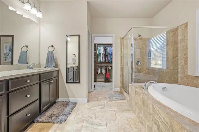 a bathroom with a granite countertop sink a mirror and a vanity