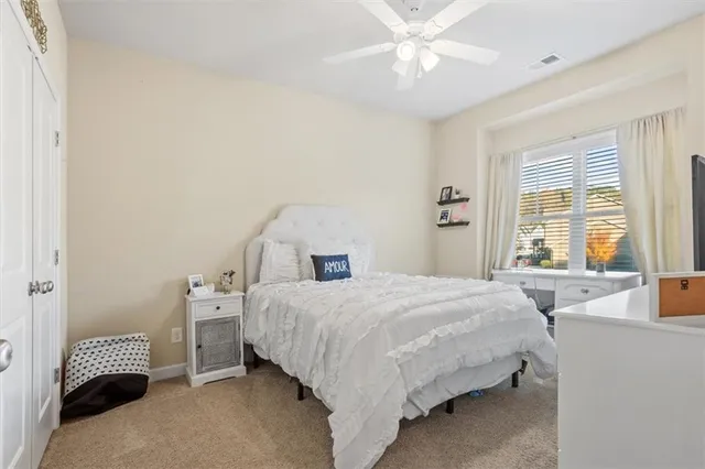 a living room with furniture and large window