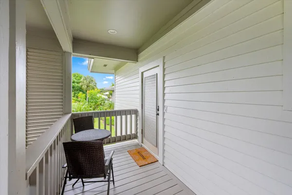 a balcony view with a seating space