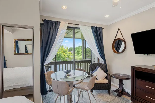 a view of a livingroom with furniture and a window