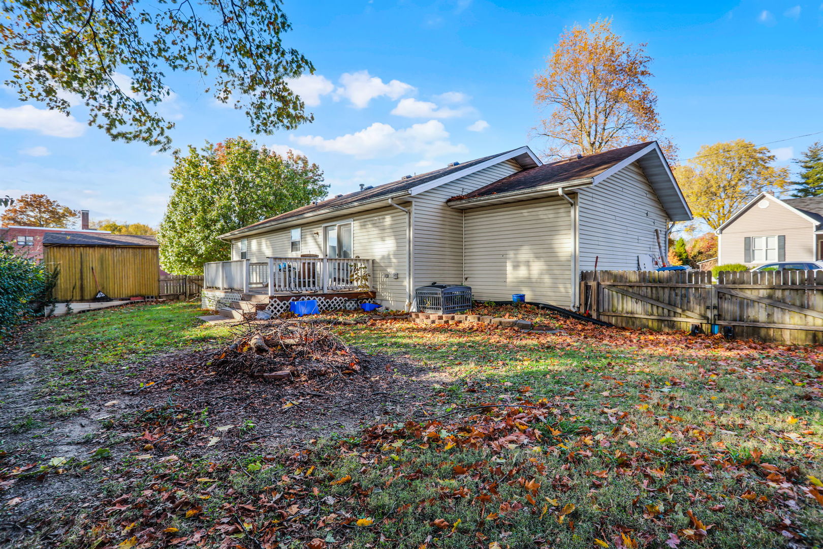 207 Byrn Street Troy, IL 62294 - Photo 18 of 19 a view of backyard of house with wooden fence and large trees