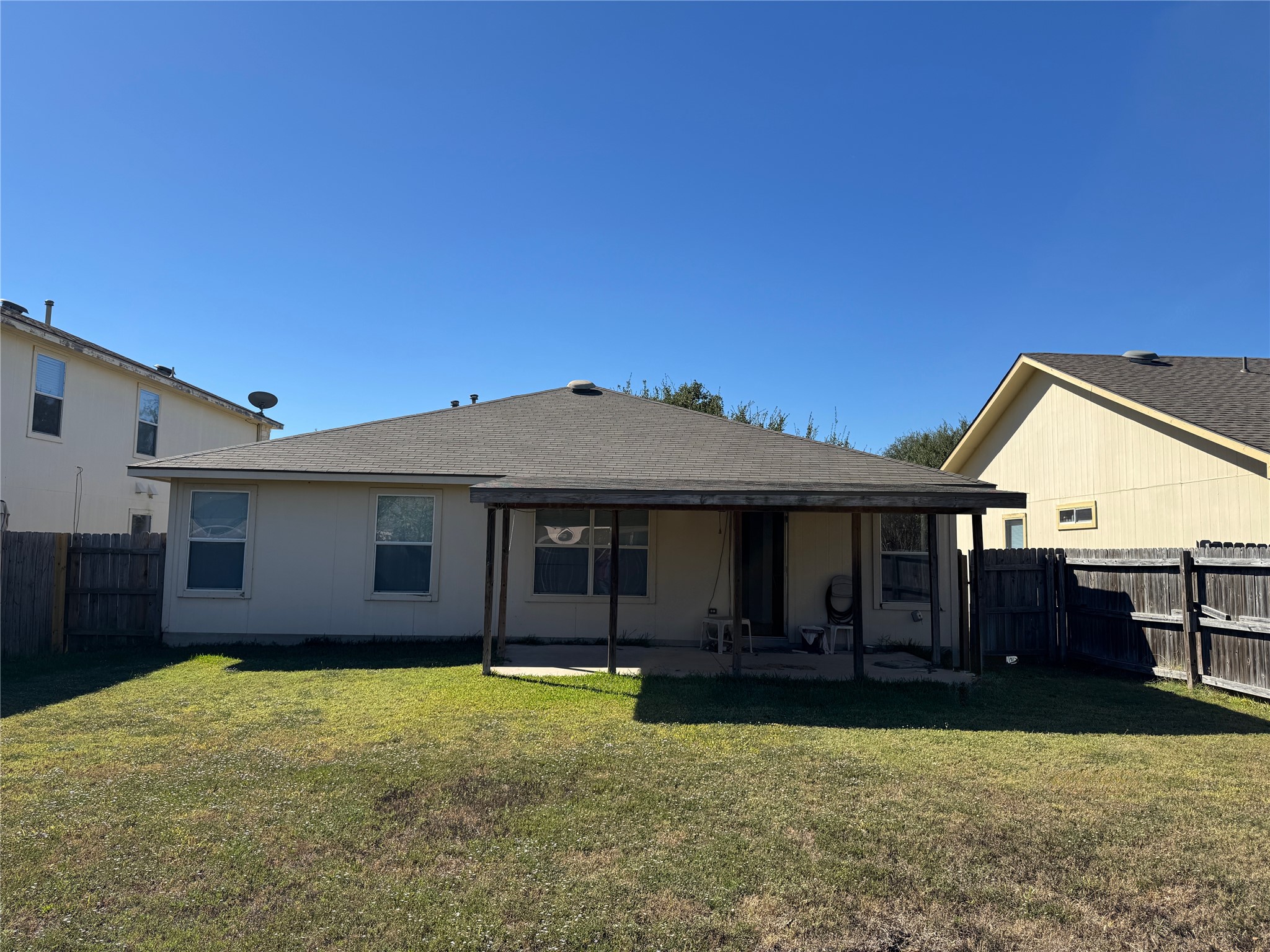 18420 Wind Tree Lane Elgin, TX 78621 - Photo 15 of 15 a view of a house with a backyard