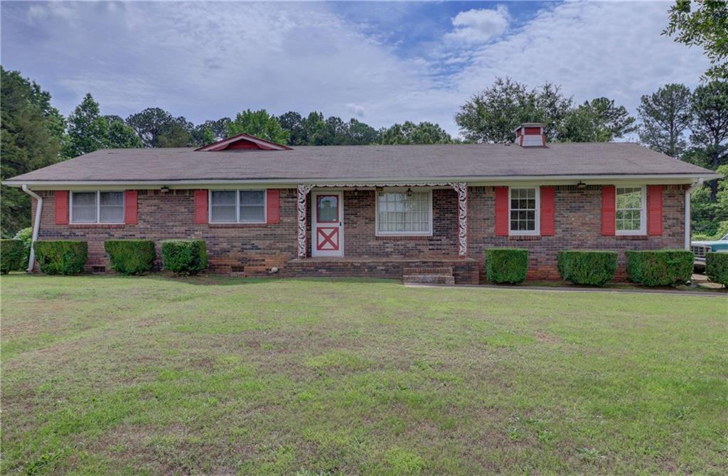 1329 Gratis Road Northwest Monroe, GA 30656 - Photo 1 of 1 front view of a house with a yard
