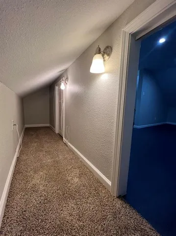 wooden floor in a hall with a window