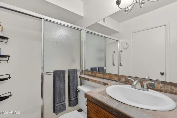 a bathroom with a sink double vanity and a mirror