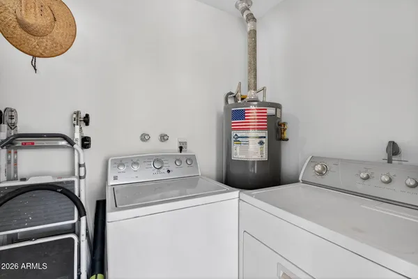 a utility room with dryer and washer